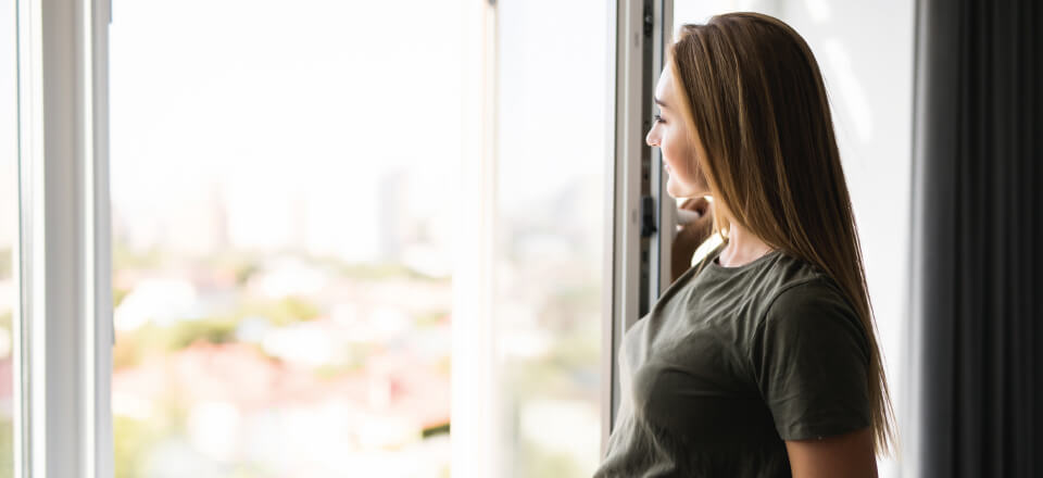 woman in front of window