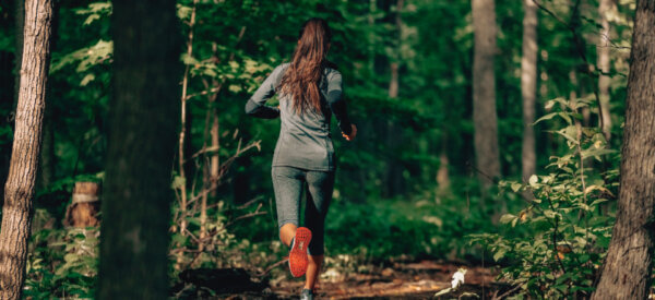 woman running in forest