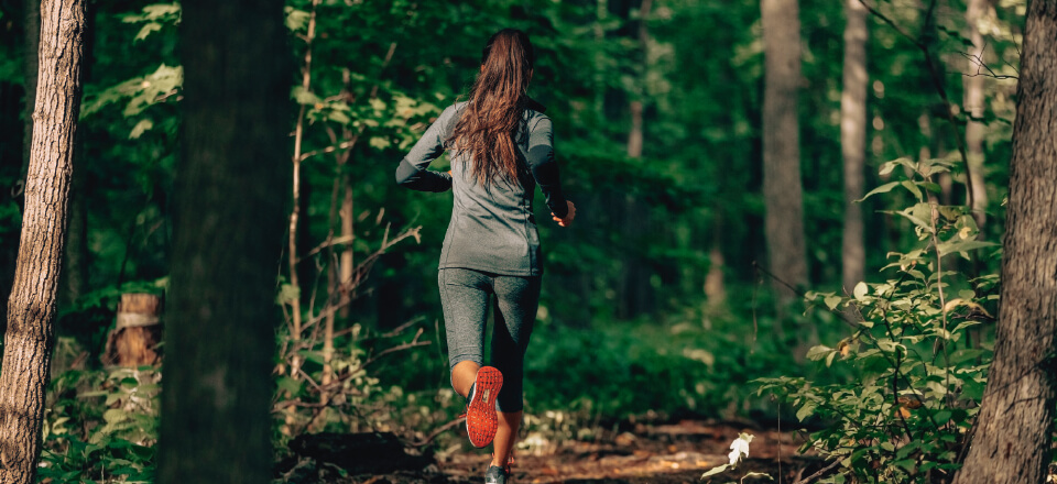 woman running in forest