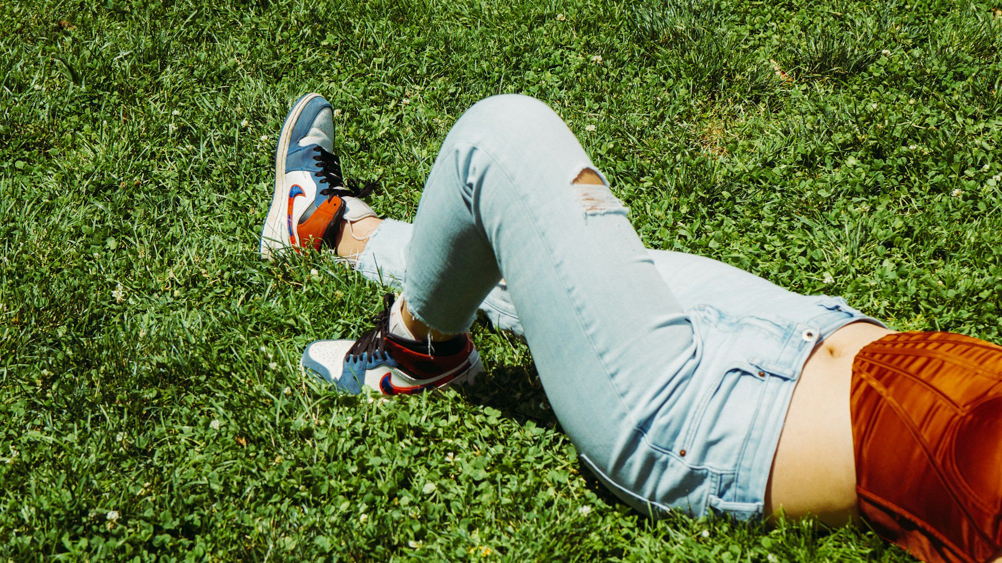a person lying on the grass